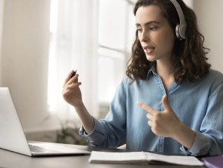 woman at laptop with a headset