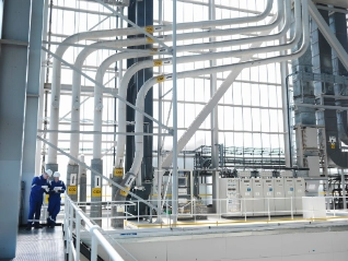two people in a power charging plant