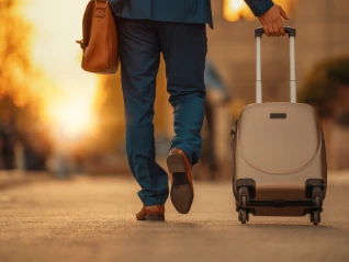 man in suit with suitcase warm