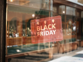 Red black friday sign in a glass window