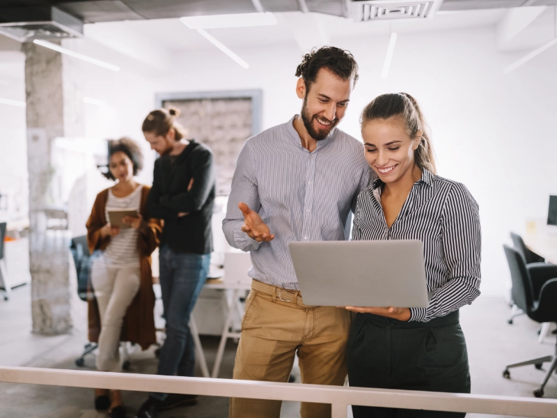 coworkers discussing ideas in an office environment