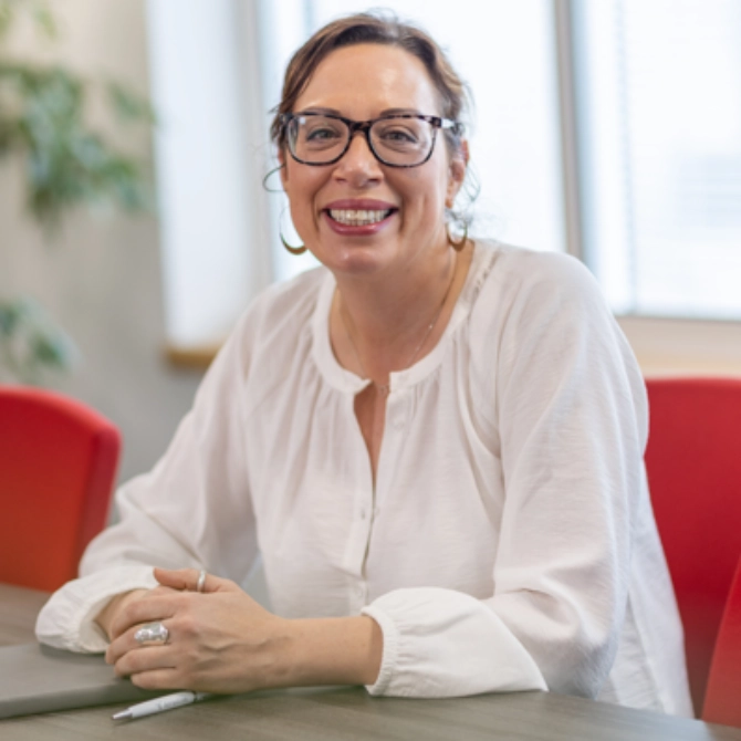 Mich C - March 2025 Michelle Corsi sat at a desk