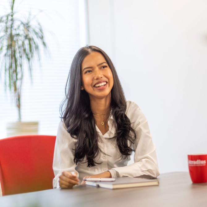 Nadia-Sukmawati-Jones-website Nadia Sukmawati-Jones laughing at a meeting
