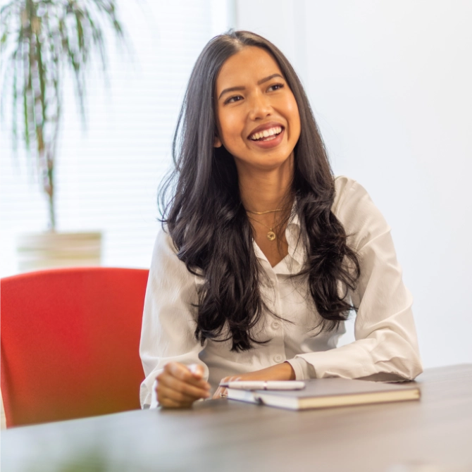 Nadia-Sukmawati-Jones-website Nadia Sukmawati-Jones laughing at a meeting