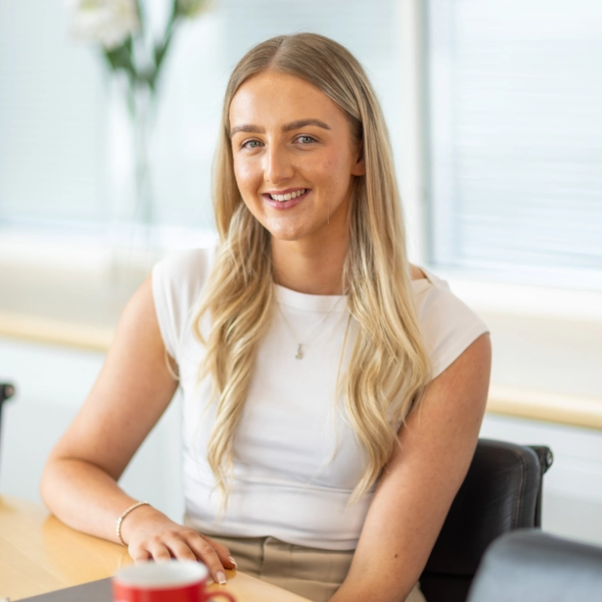 Danielle Palmer Danielle Palmer sat at a desk