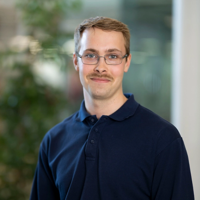 Headshot of James Napier outside the Atradius Building in Cardiff