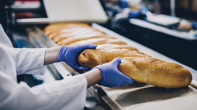 Baker with freshly baked bread
