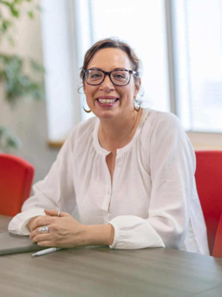 Michelle Corsi sat at a desk