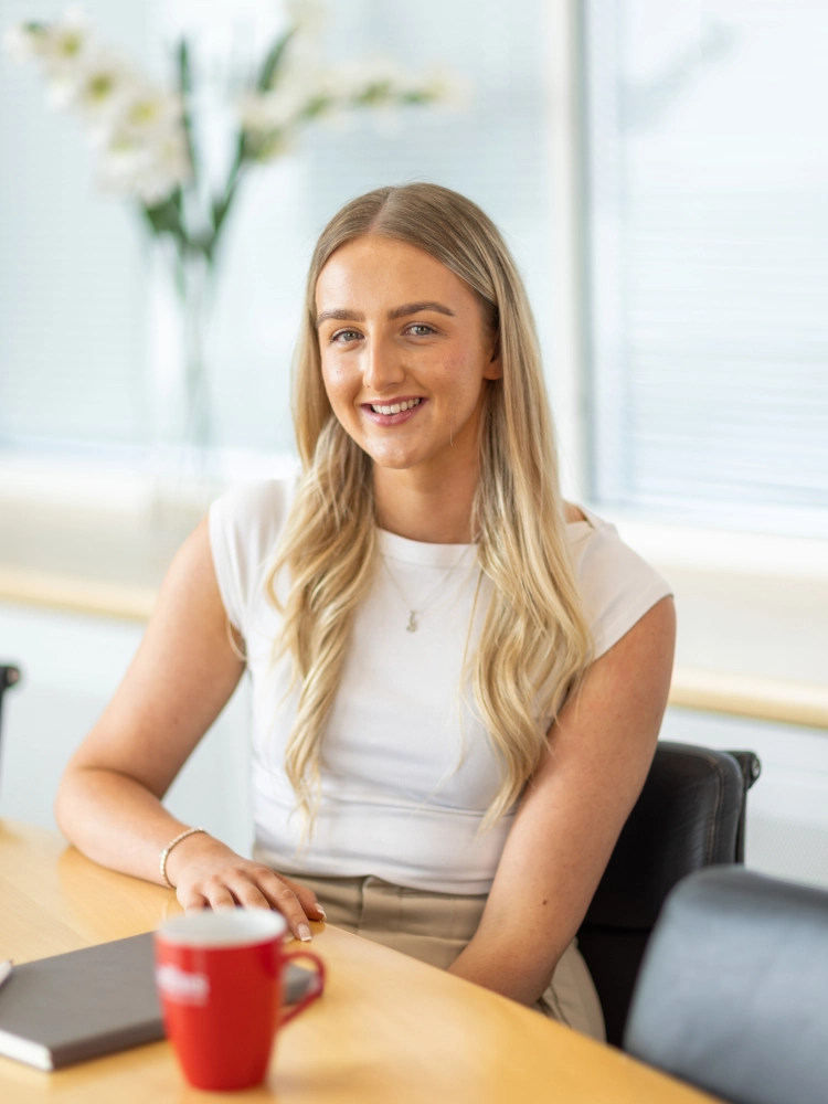 Danielle Palmer sat at a desk