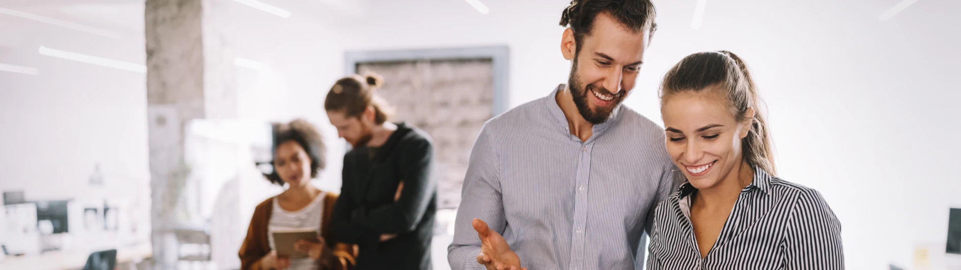coworkers discussing ideas in an office environment