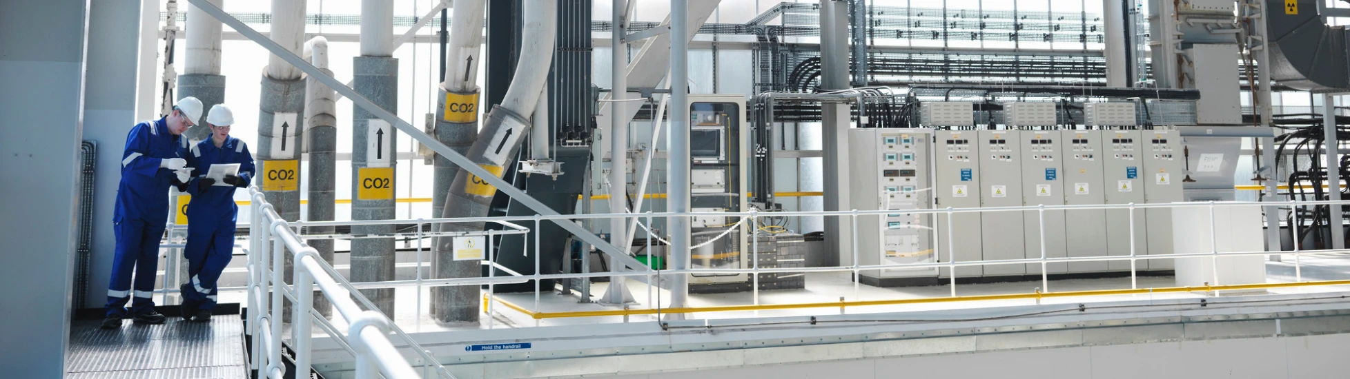 two people in a power charging plant