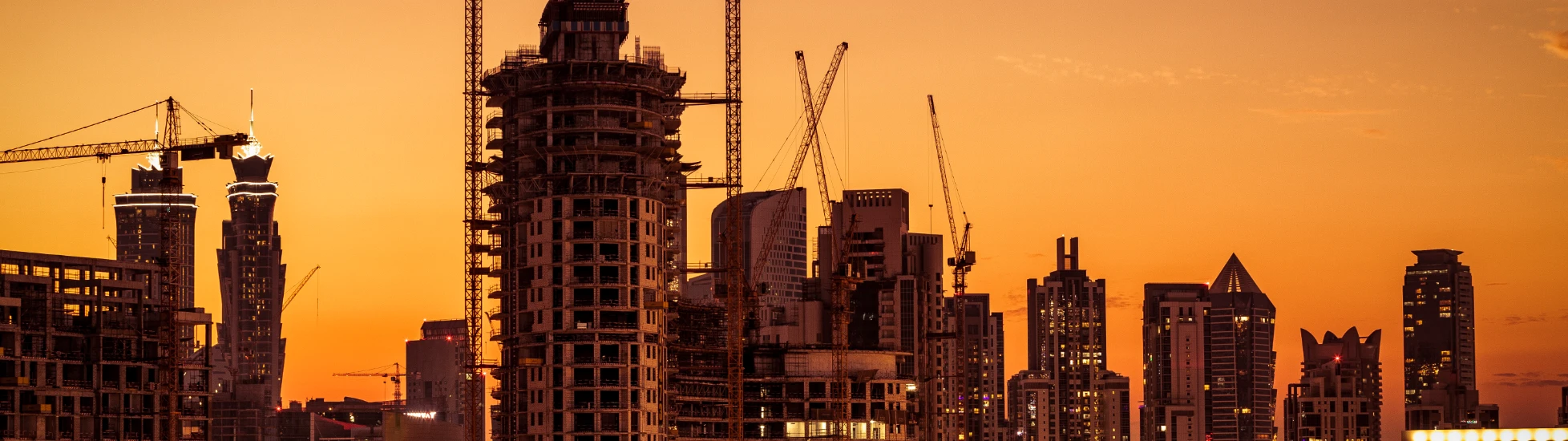 City construction site at sunset