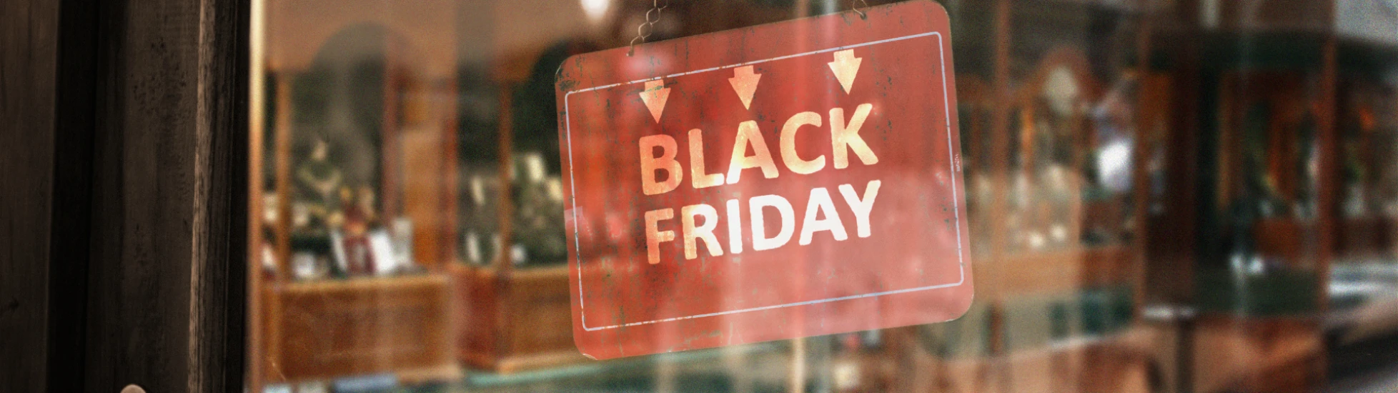 Red black friday sign in a glass window