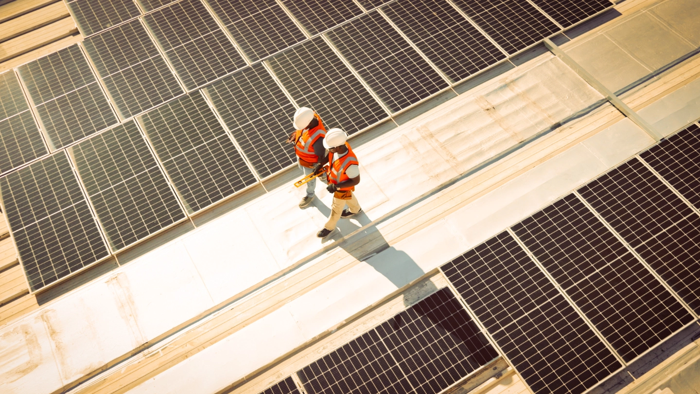 Two solar panel workers walking image