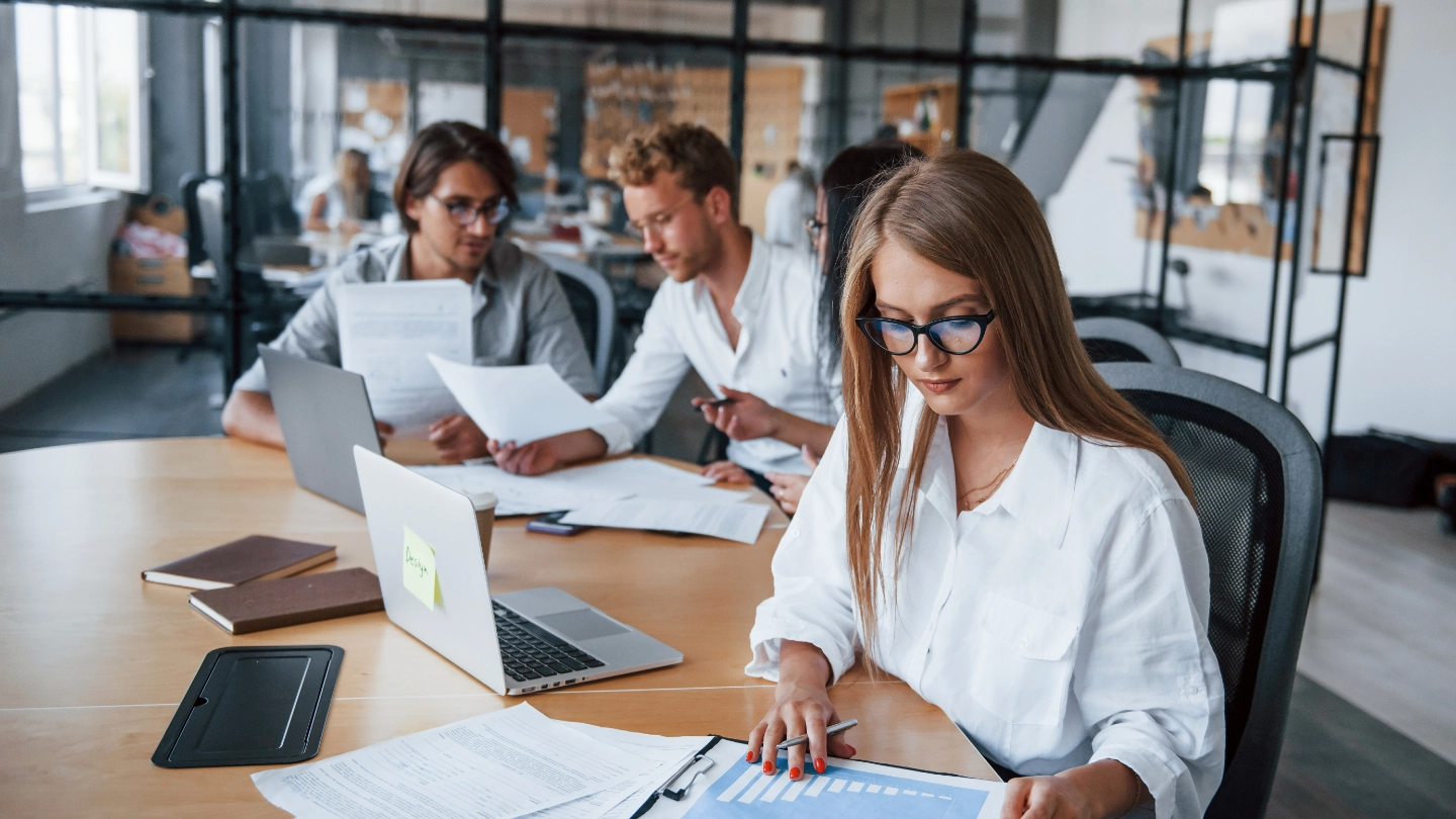 three colleagues working in an office image