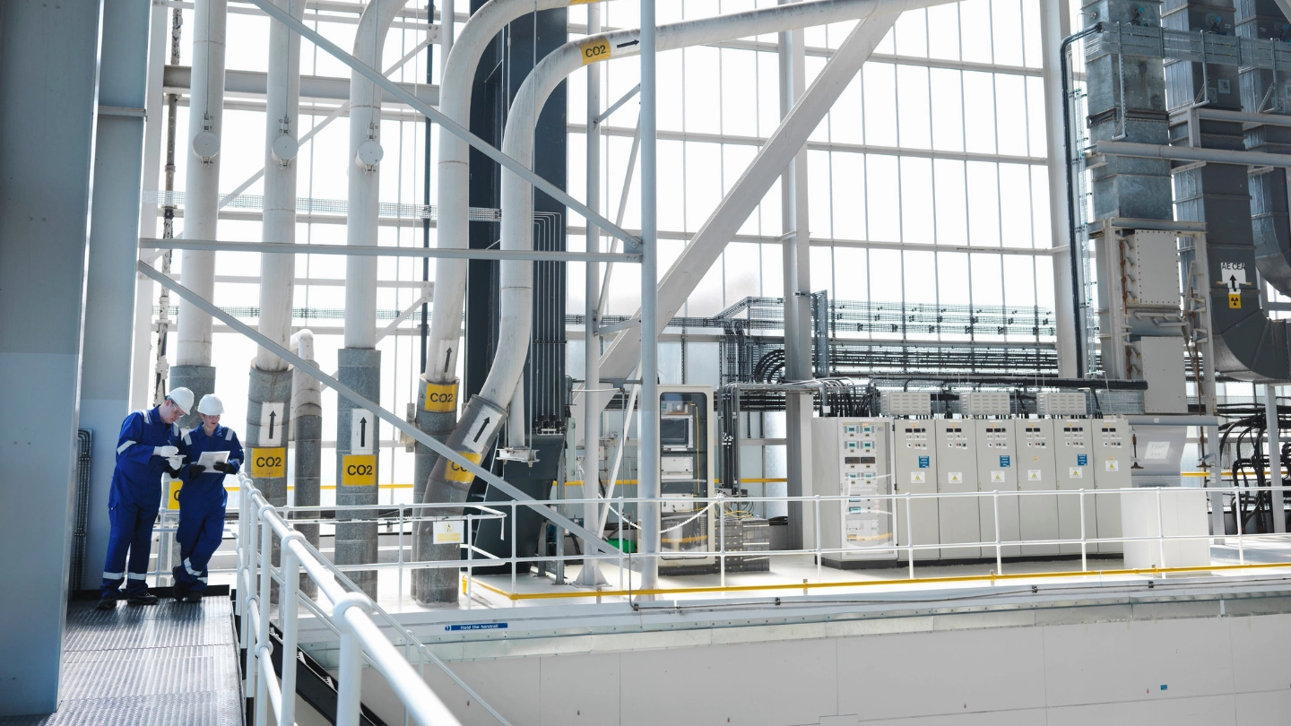 two people in a power charging plant