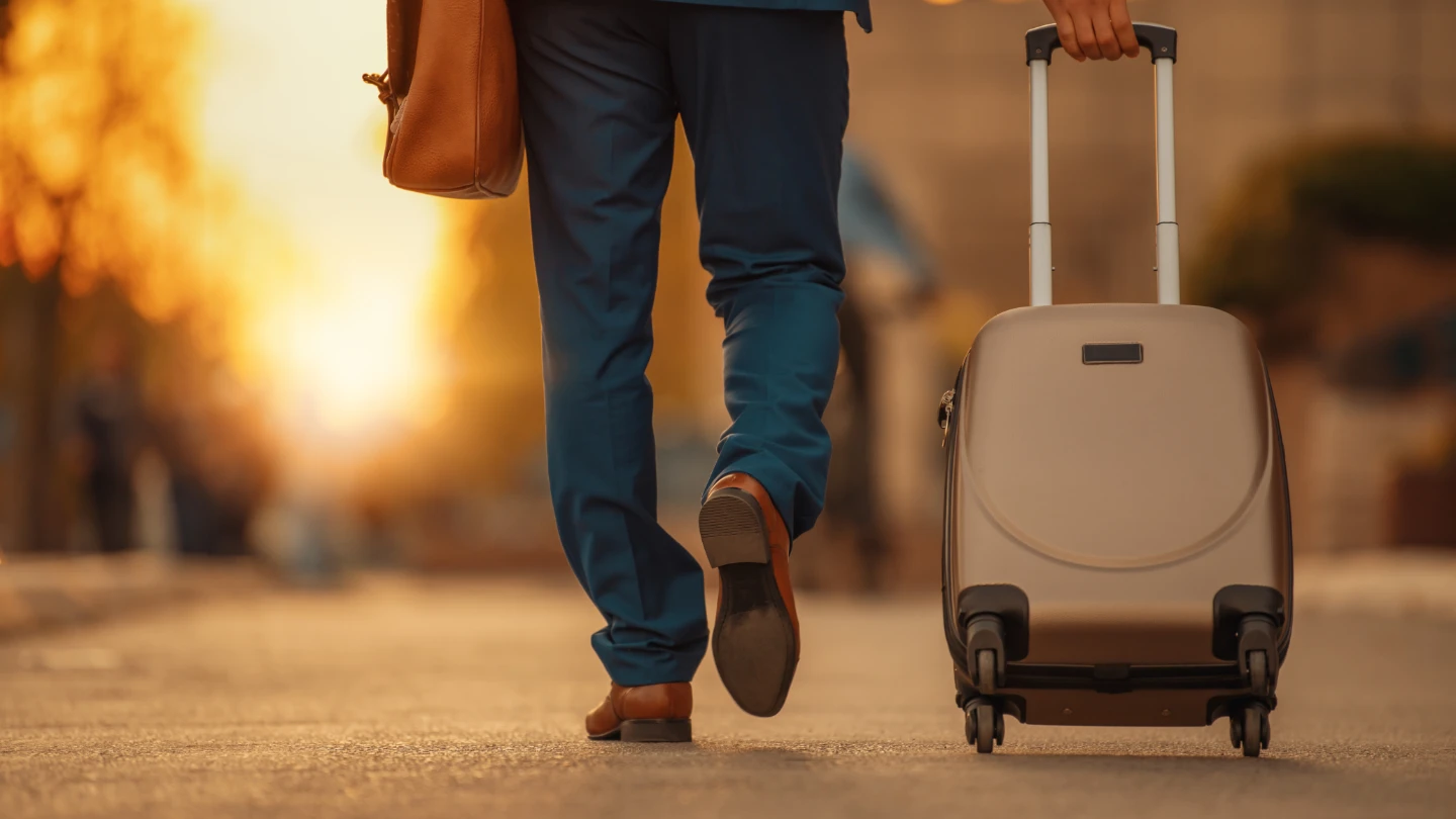 man in suit with suitcase warm