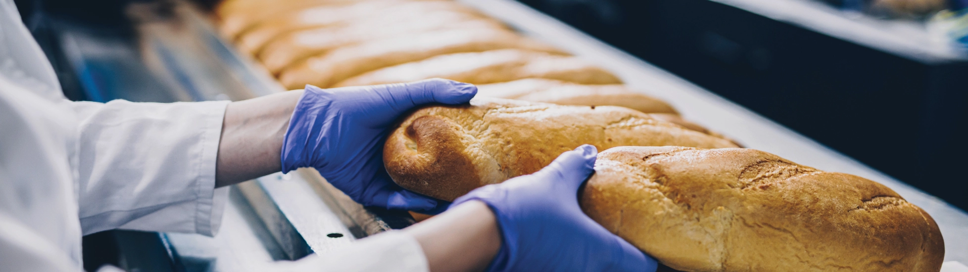 Baker with freshly baked bread
